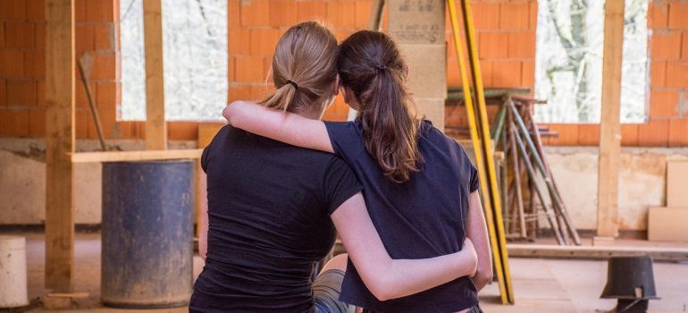 two female friends hugging