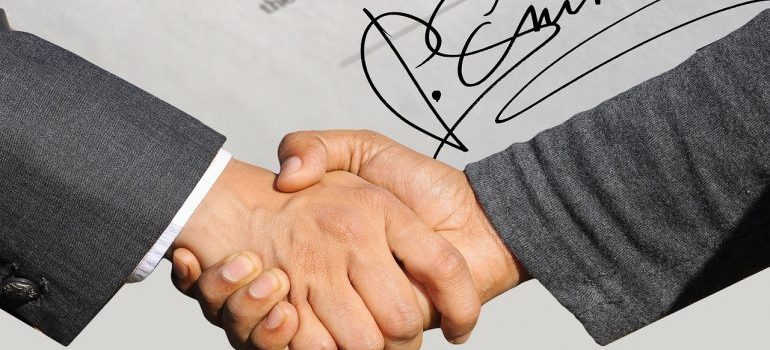 a person signing a moving contract